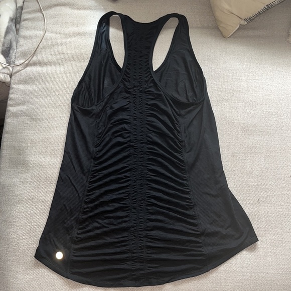 Lululemon tank top. Says “sweat life” very cute back detail. In great condition! - Picture 3 of 3